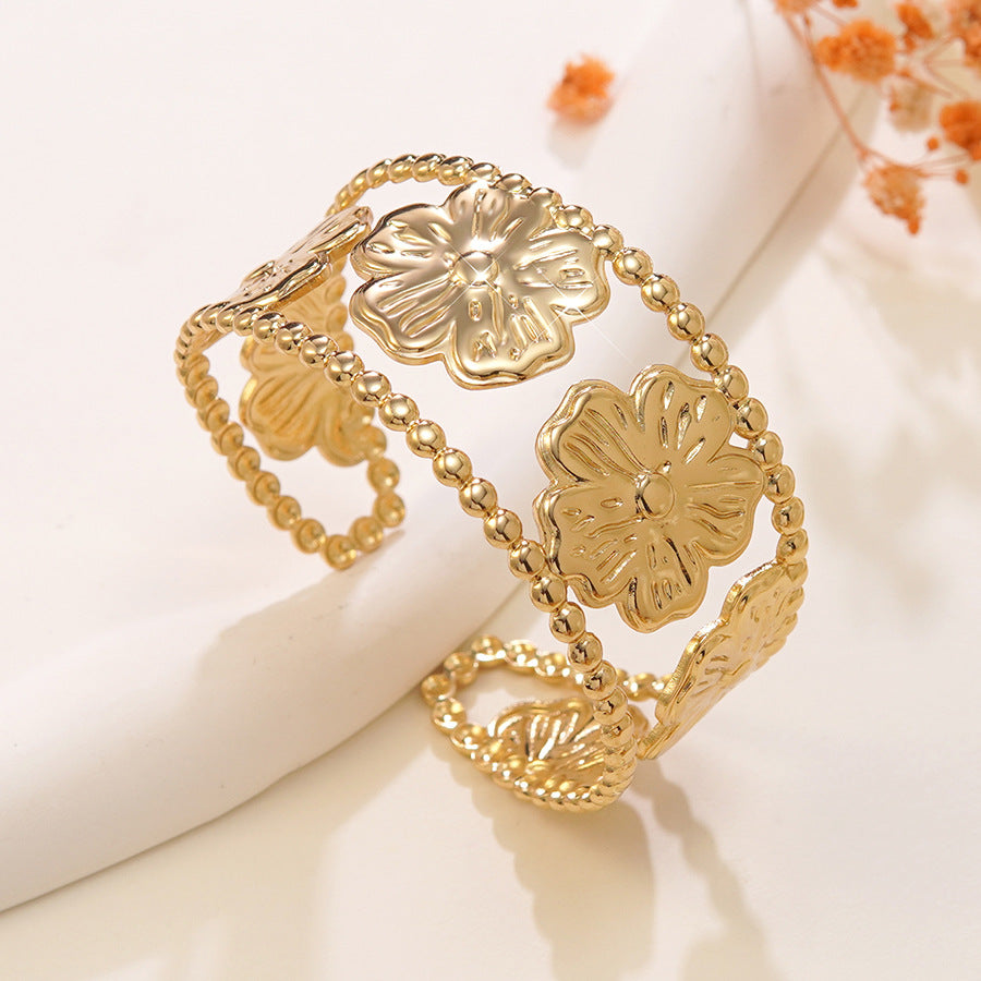 Electroplated Flowers Bangle For Women In 304 Stainless Steel With Golden Plated Finish And 0.03µm Coating Thickness