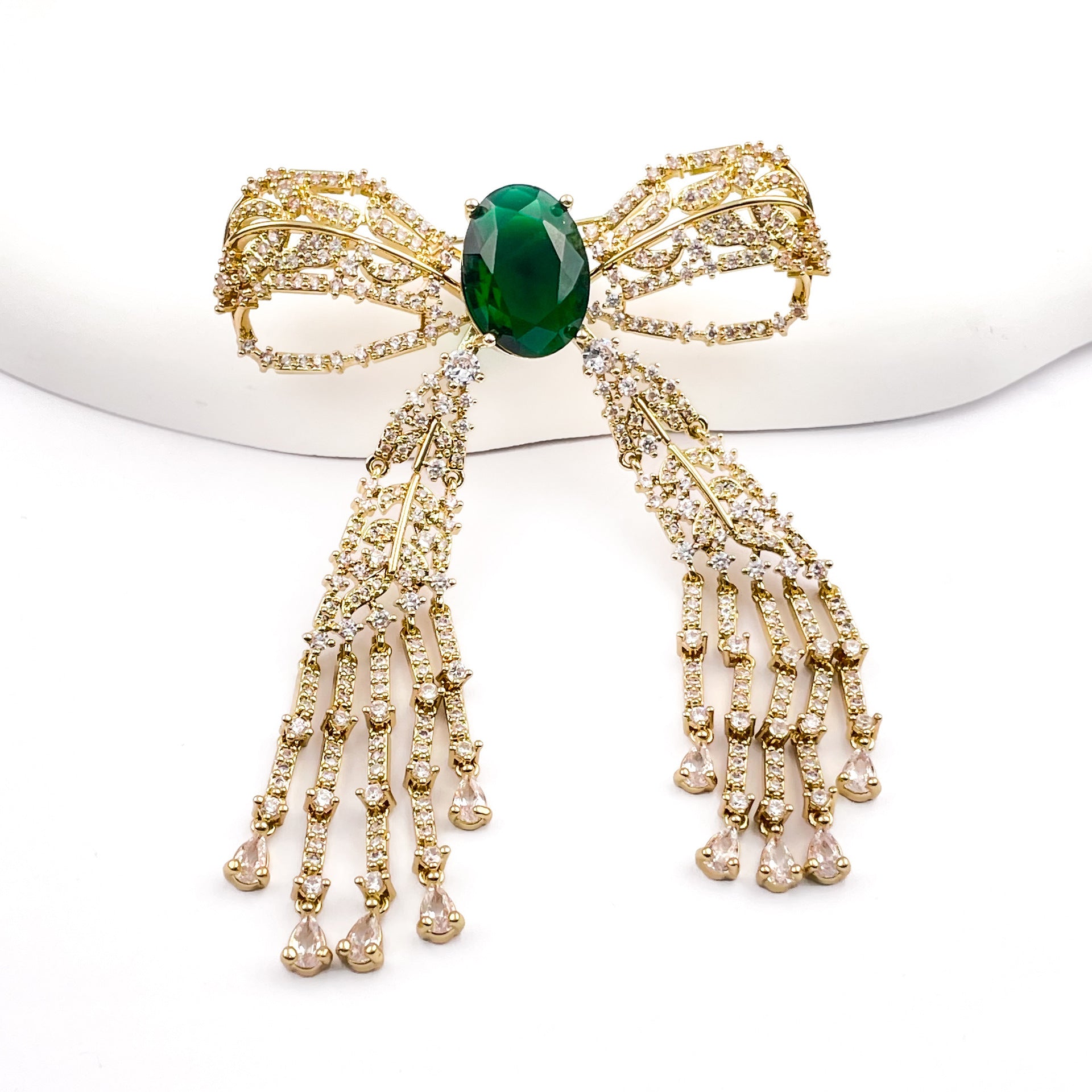 Copper Bow Tie Pin With Electroplated Finish Featuring May Birthstone Emerald