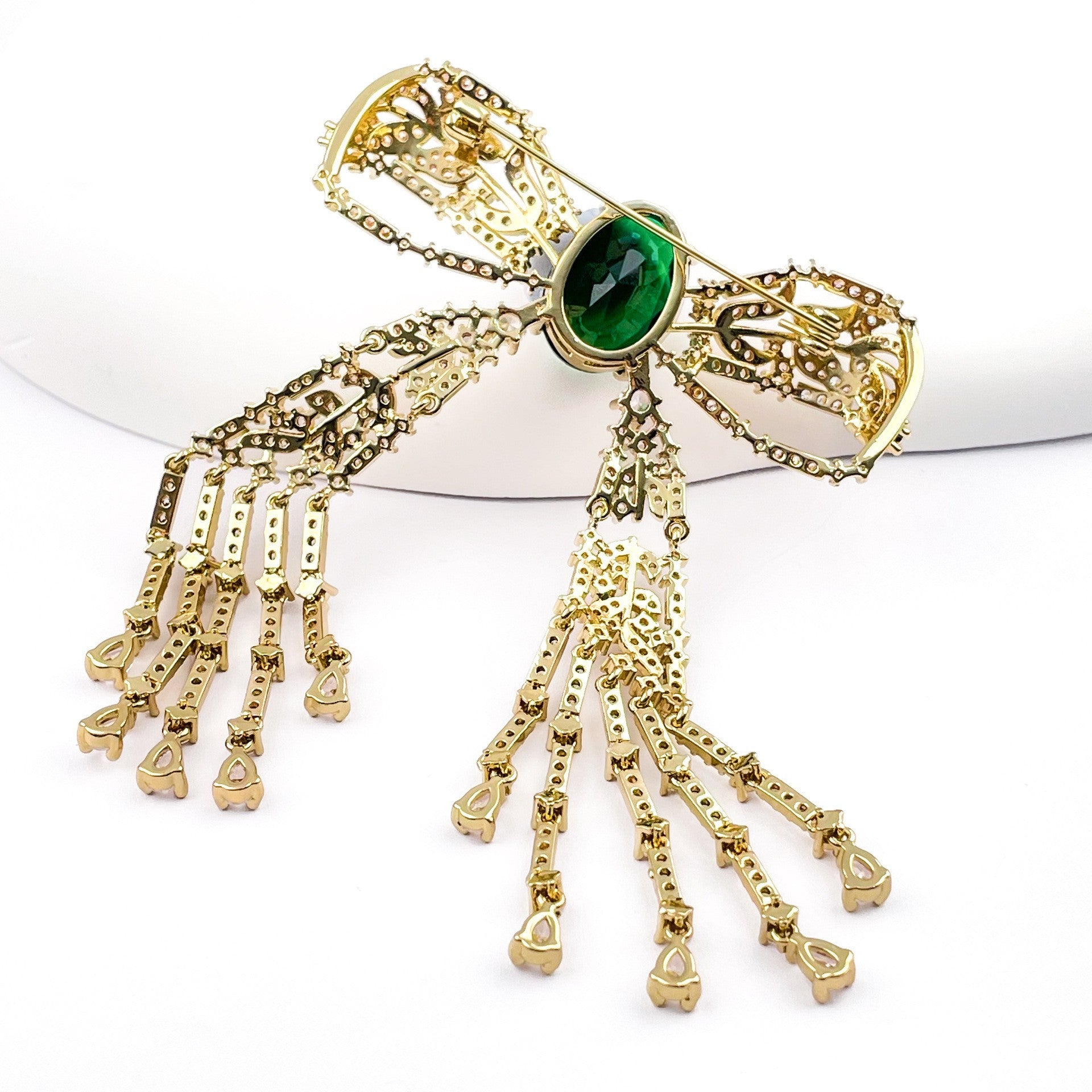 Copper Bow Tie Pin With Electroplated Finish Featuring May Birthstone Emerald