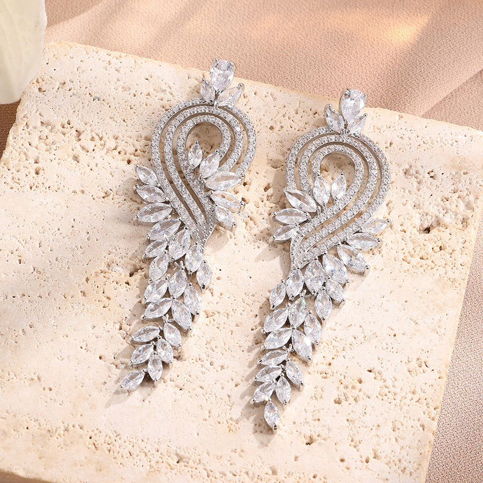 Heart Shape Tassel Earrings For Wedding Season, Unisex Copper Studs With Platinum Plated Finish And Rhinestone Inlay