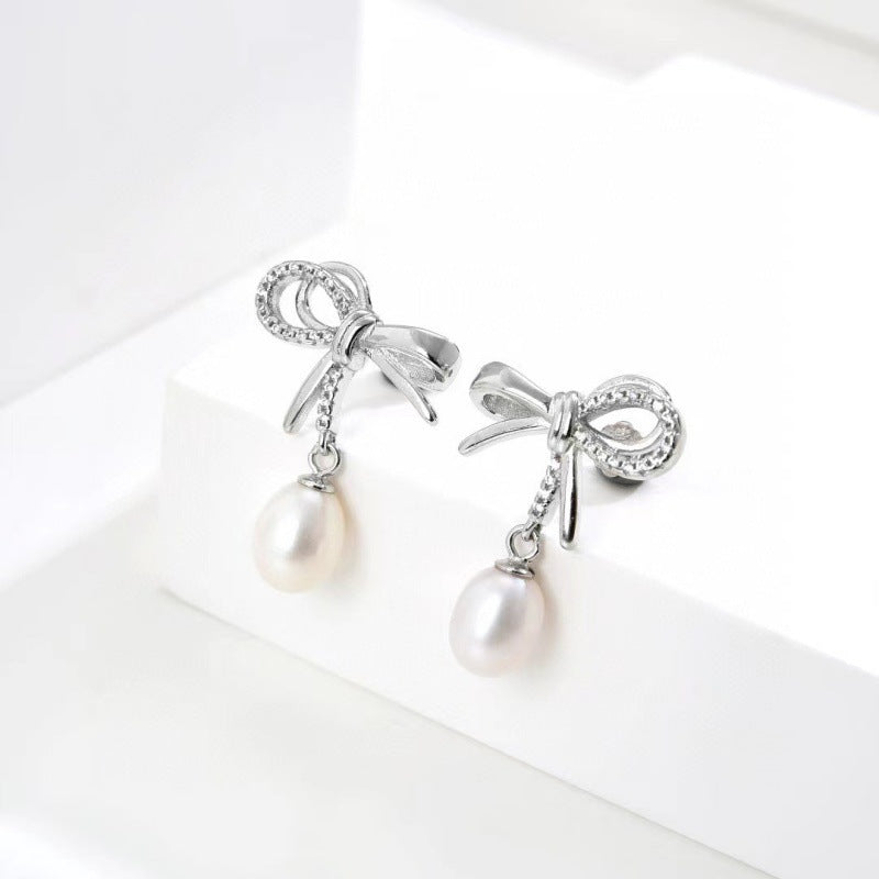 Elegant Bow Tie Earrings For Women In Silver Featuring 925 Sterling Silver Posts