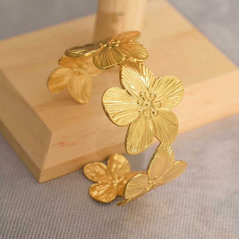 Electroplated Flowers Bangle For Women In 304 Stainless Steel With Golden Plated Finish And 0.03µm Coating Thickness
