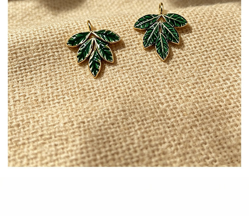 Maple Leaf Pendant In 304 Stainless Steel With PVD Coated Gold Plating Process, Featuring Enamel And Electroplated Green Finish