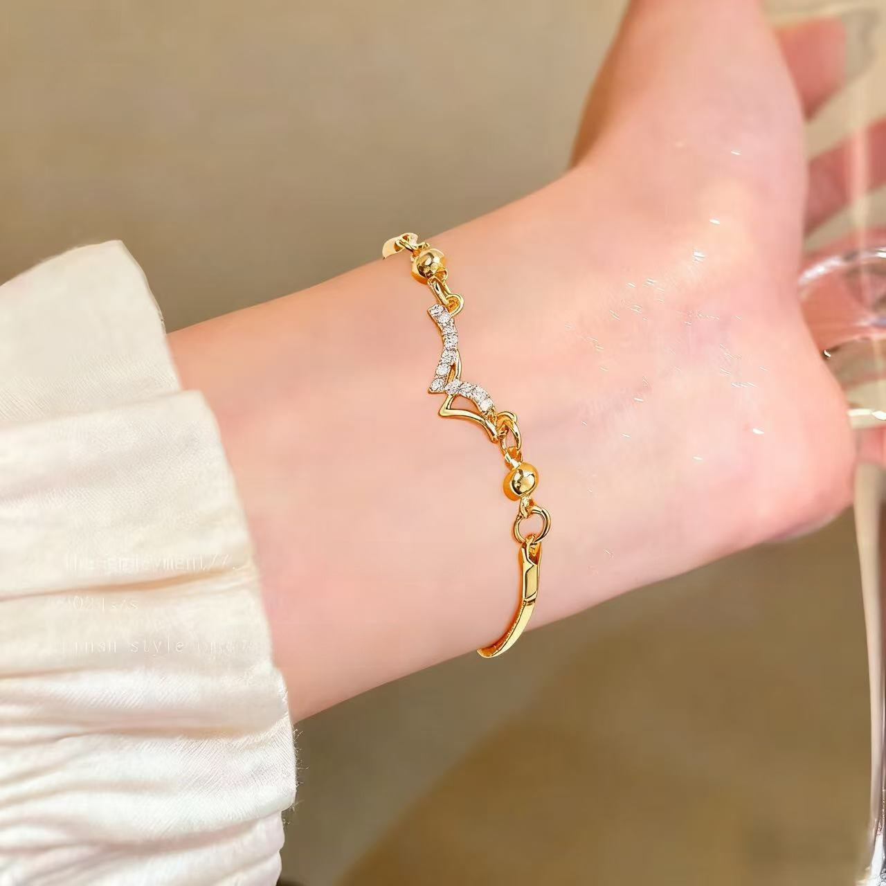 Cute Heart Shape Elaborate Copper Bracelets With KC Golden Electroplated Finish And Zircon Inlay Featuring Slider Chain