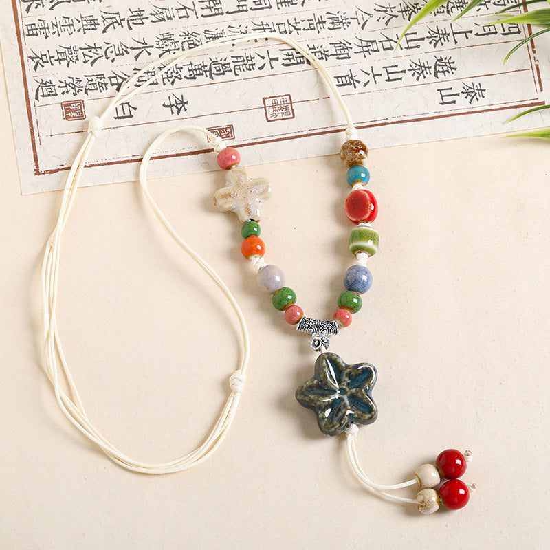 Ethnic Style Unisex Butterfly Braid Sweater Chain Necklace Featuring Ceramic Pendant With Woven Chain