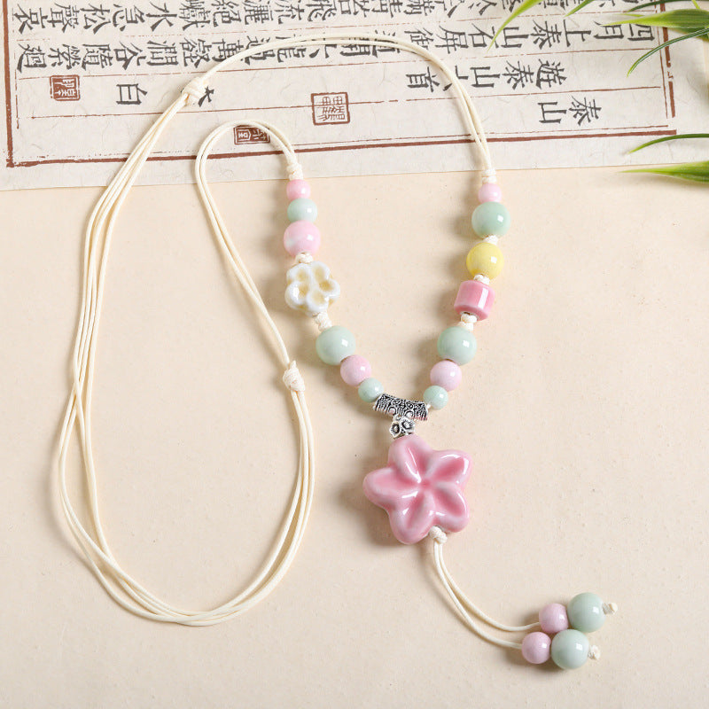 Ethnic Style Unisex Butterfly Braid Sweater Chain Necklace Featuring Ceramic Pendant With Woven Chain