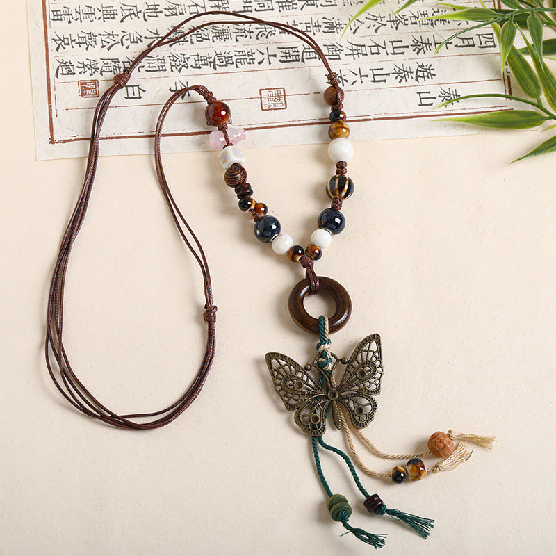 Ethnic Style Unisex Butterfly Braid Sweater Chain Necklace Featuring Ceramic Pendant With Woven Chain