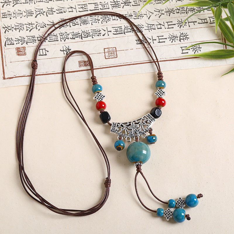 Ethnic Style Unisex Butterfly Braid Sweater Chain Necklace Featuring Ceramic Pendant With Woven Chain