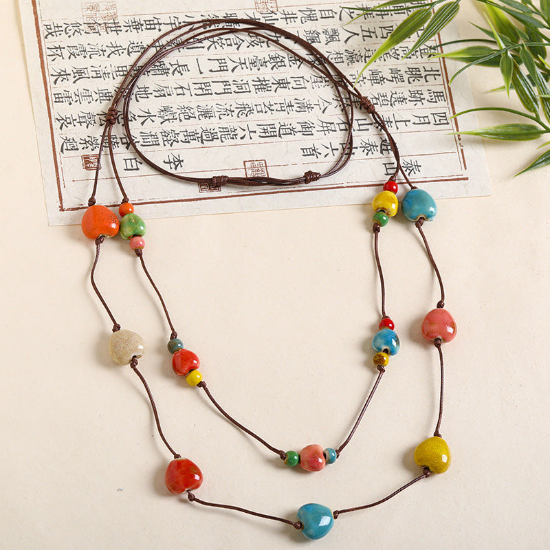 Ethnic Style Unisex Butterfly Braid Sweater Chain Necklace Featuring Ceramic Pendant With Woven Chain