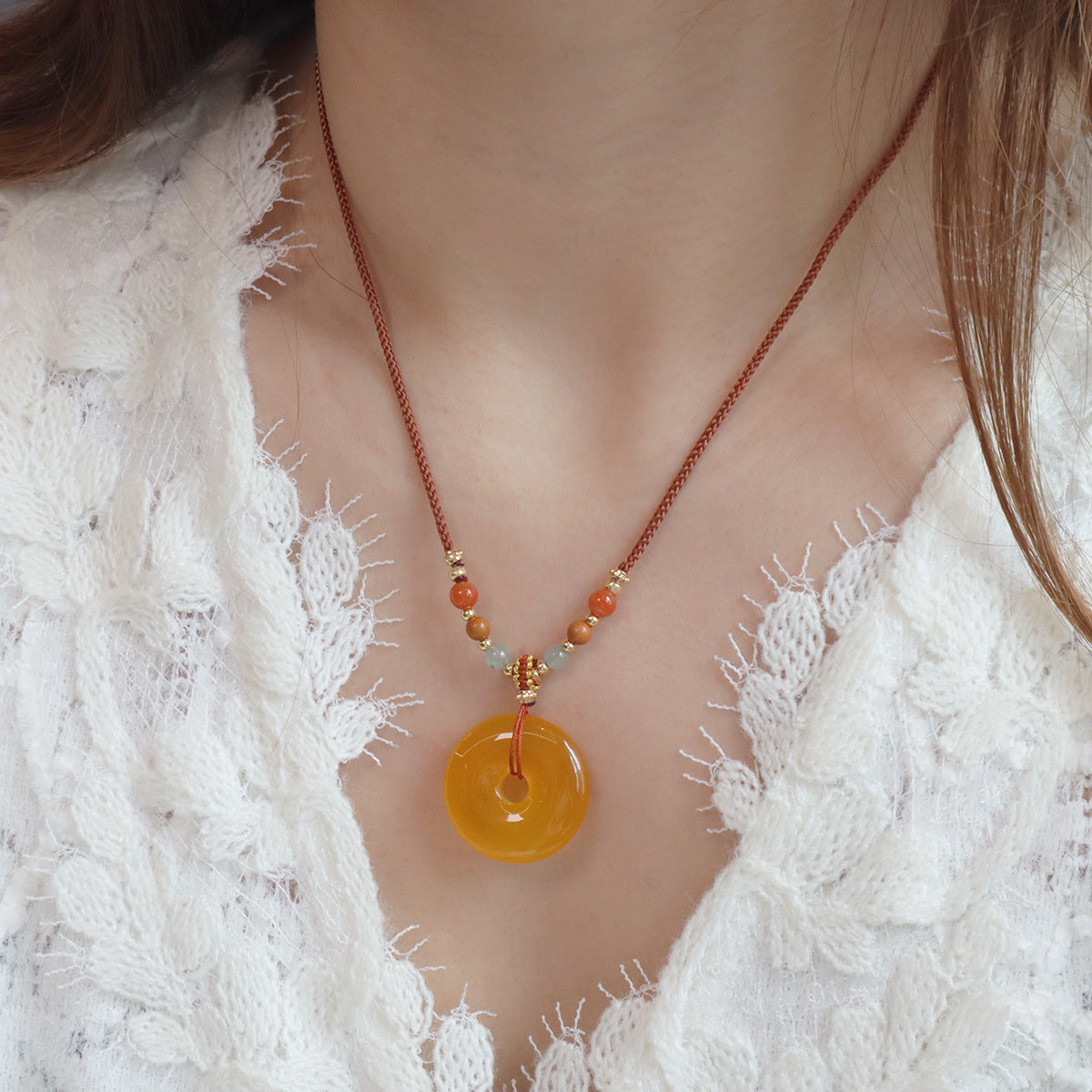 Ethnic Style Buddha Pendant Necklace For Adults With Yellow Braid And Chalcedony Inlay Featuring A Rope Woven Chain
