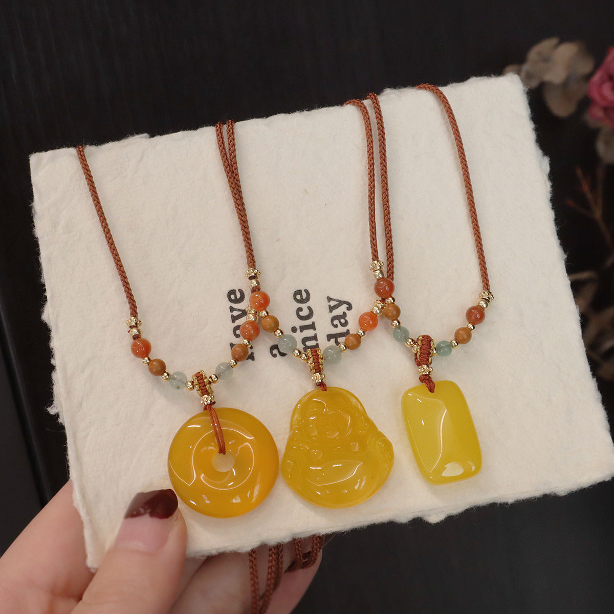 Ethnic Style Buddha Pendant Necklace For Adults With Yellow Braid And Chalcedony Inlay Featuring A Rope Woven Chain
