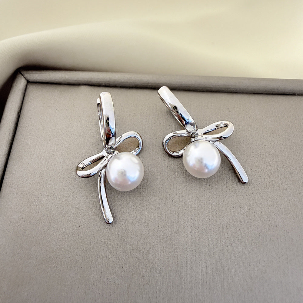 Elegant Bow Tie Earrings For Women In Electroplated Copper With Artificial Pearl Inlay