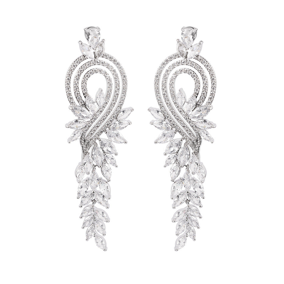 Heart Shape Tassel Earrings For Wedding Season, Unisex Copper Studs With Platinum Plated Finish And Rhinestone Inlay