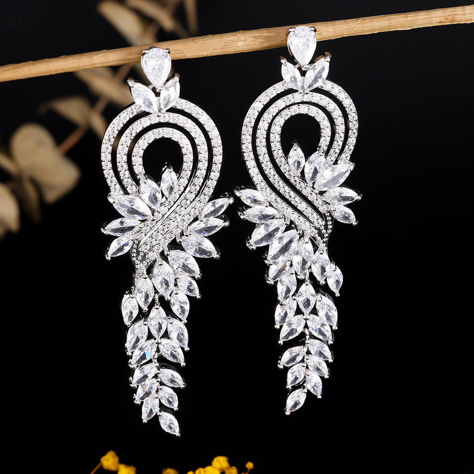 Heart Shape Tassel Earrings For Wedding Season, Unisex Copper Studs With Platinum Plated Finish And Rhinestone Inlay