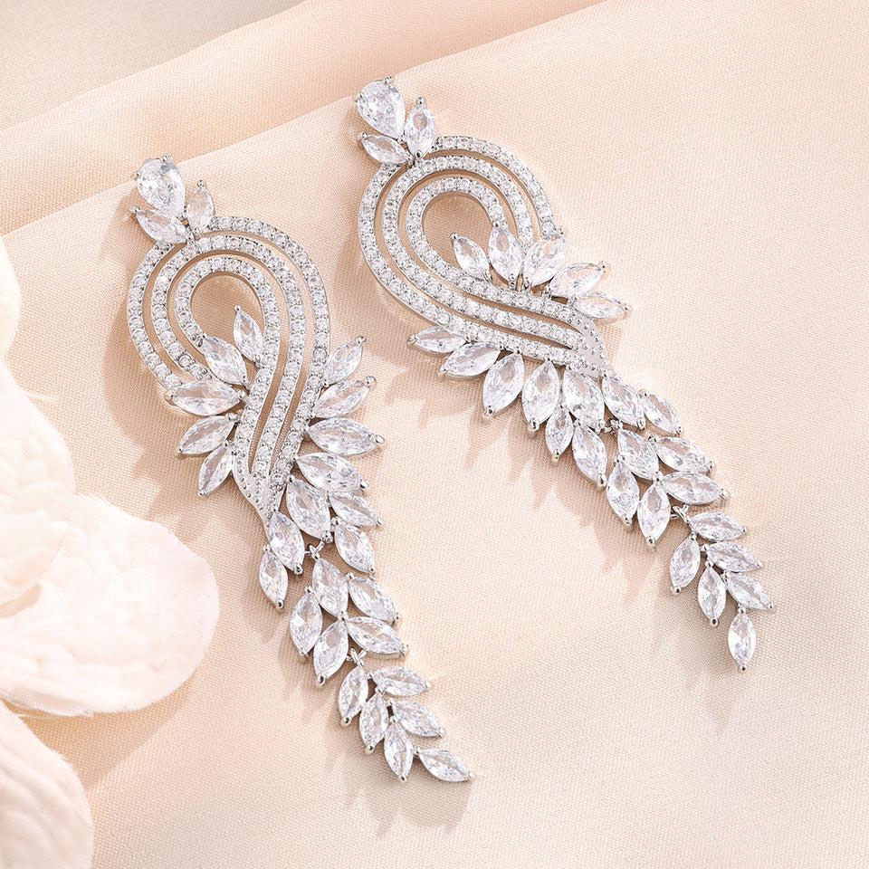 Heart Shape Tassel Earrings For Wedding Season, Unisex Copper Studs With Platinum Plated Finish And Rhinestone Inlay