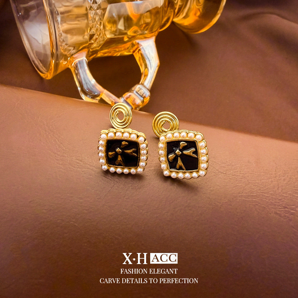 Elegant Heart Shape Clip Earrings For Women In Gold Alloy With Electroplated Finish And Artificial Pearl Inlay