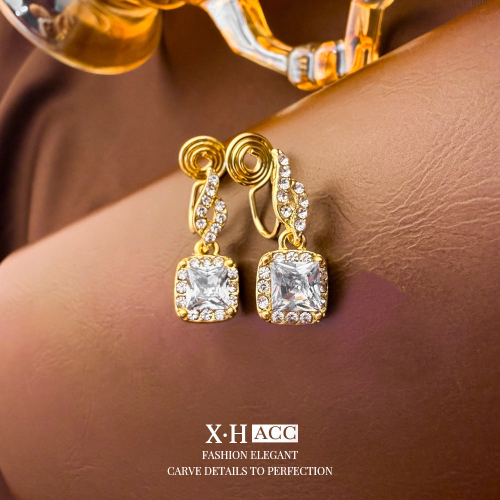 Elegant Heart Shape Clip Earrings For Women In Gold Alloy With Electroplated Finish And Artificial Pearl Inlay