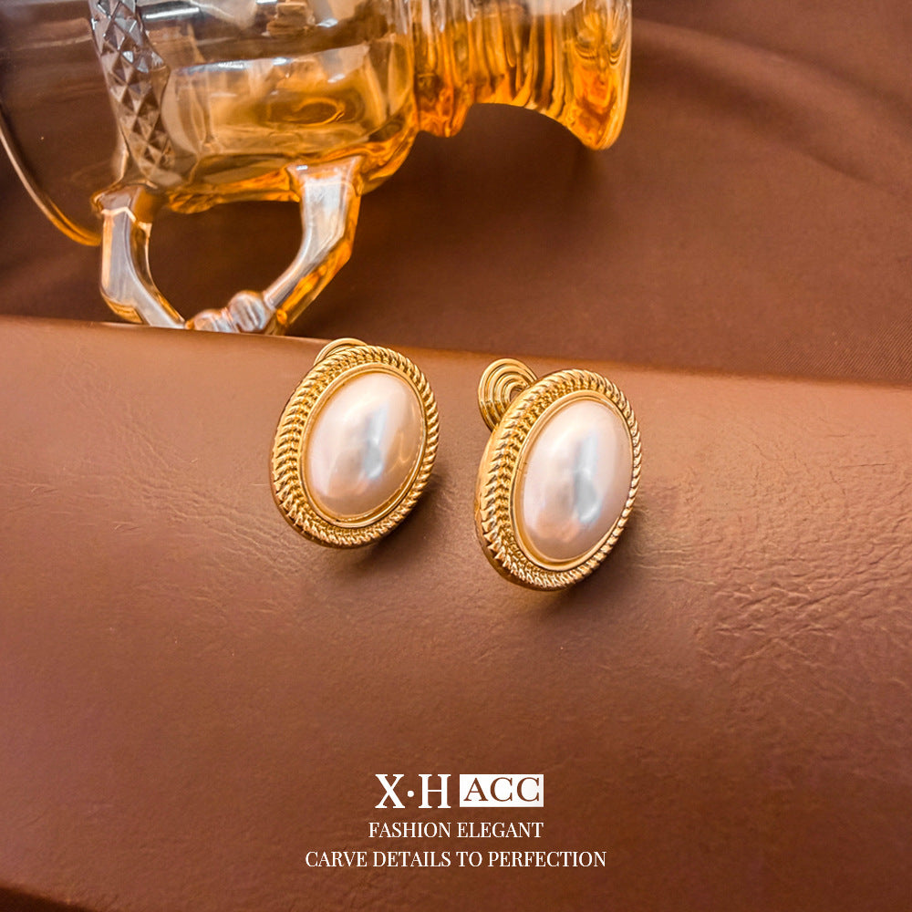 Elegant Heart Shape Clip Earrings For Women In Gold Alloy With Electroplated Finish And Artificial Pearl Inlay