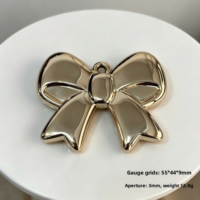 Bow Tie Pendant In Acrylic With KC Golden Plated Finish Featuring Electroplated Silver Jewelry Accessories
