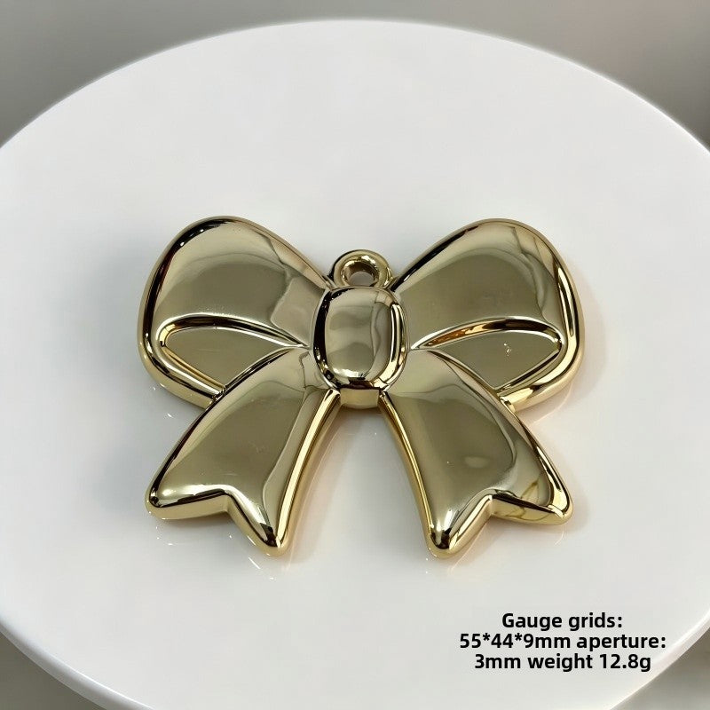 Bow Tie Pendant In Acrylic With KC Golden Plated Finish Featuring Electroplated Silver Jewelry Accessories