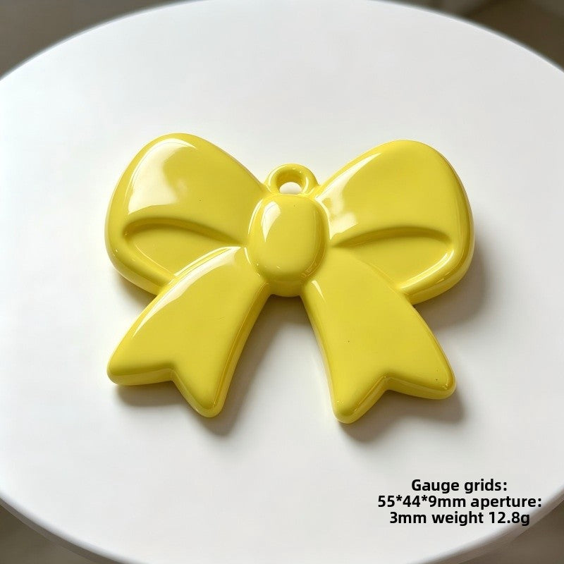 Bow Tie Pendant In Acrylic With KC Golden Plated Finish Featuring Electroplated Silver Jewelry Accessories