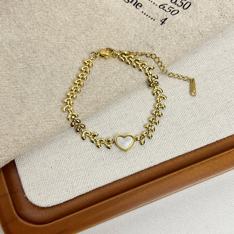 Leaf Pattern Women’s Bracelet In Titanium Steel With 18K Real Gold Electroplated Finish, Available In Gold