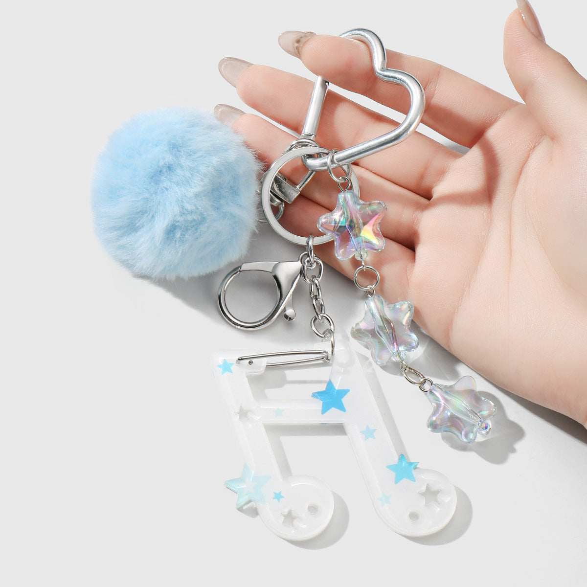 Fuzzy Ball Key Chain In White Featuring Durable Alloy Material