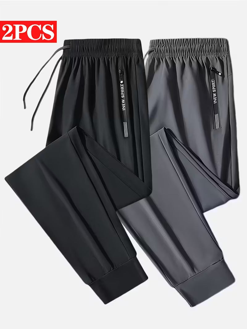 Men's Solid Color Full Length Jogging Pants In Nylon Fabric With Zipper Detail For Sport Style