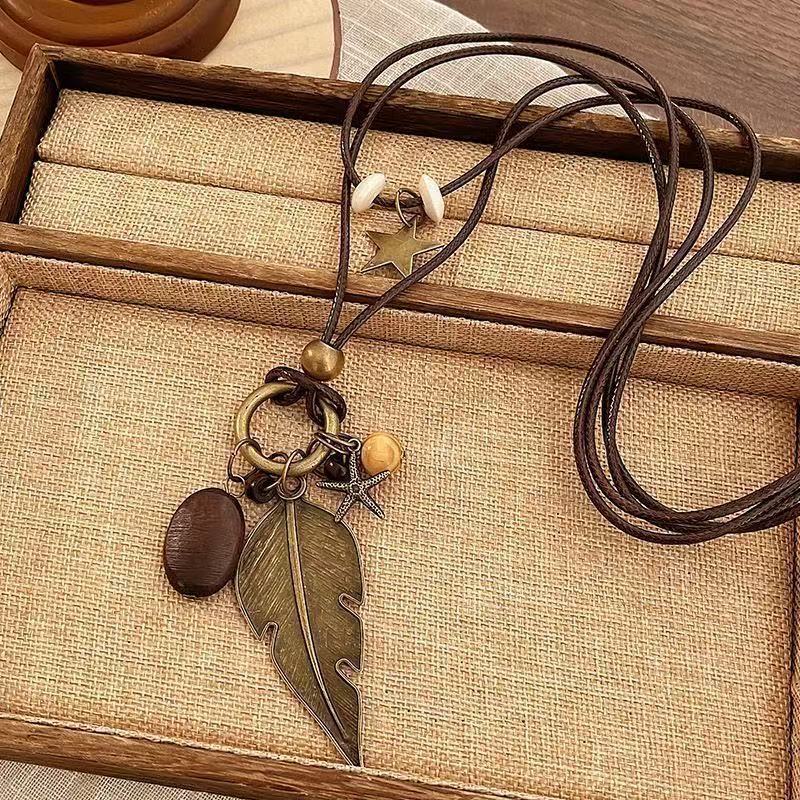 Bohemian Feather Sweater Chain Necklace For Women With Electroplated Bronze Plating And Alloy Pendant