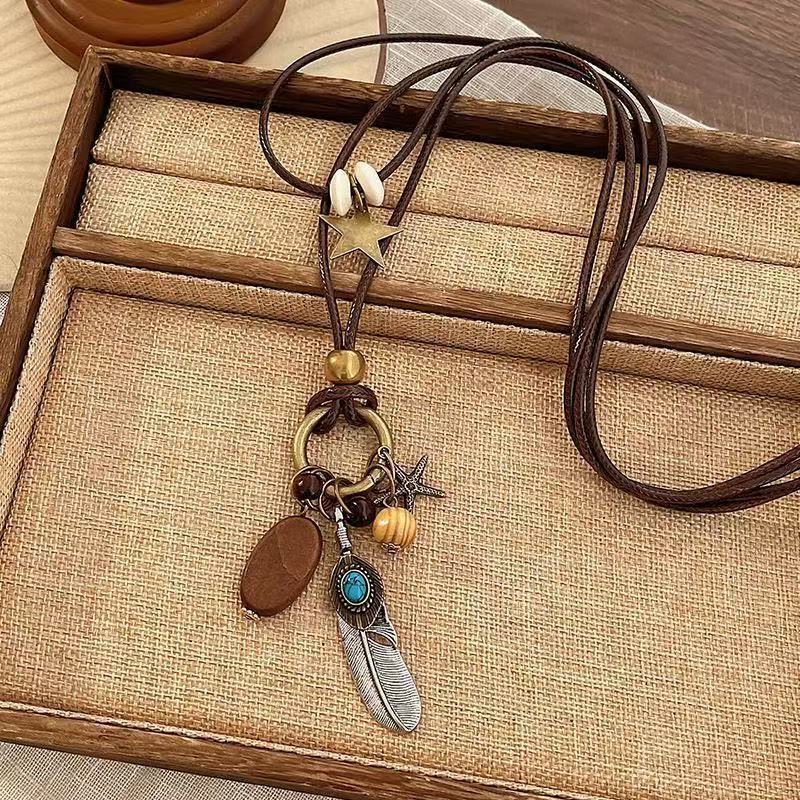 Bohemian Feather Sweater Chain Necklace For Women With Electroplated Bronze Plating And Alloy Pendant