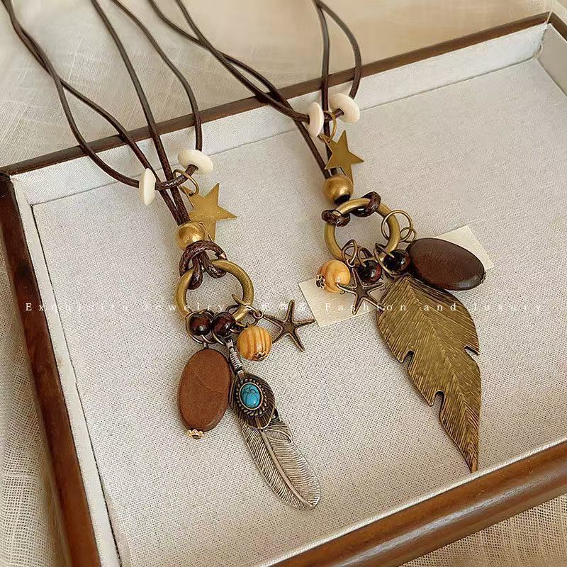 Bohemian Feather Sweater Chain Necklace For Women With Electroplated Bronze Plating And Alloy Pendant