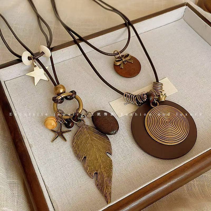 Bohemian Feather Sweater Chain Necklace For Women With Electroplated Bronze Plating And Alloy Pendant