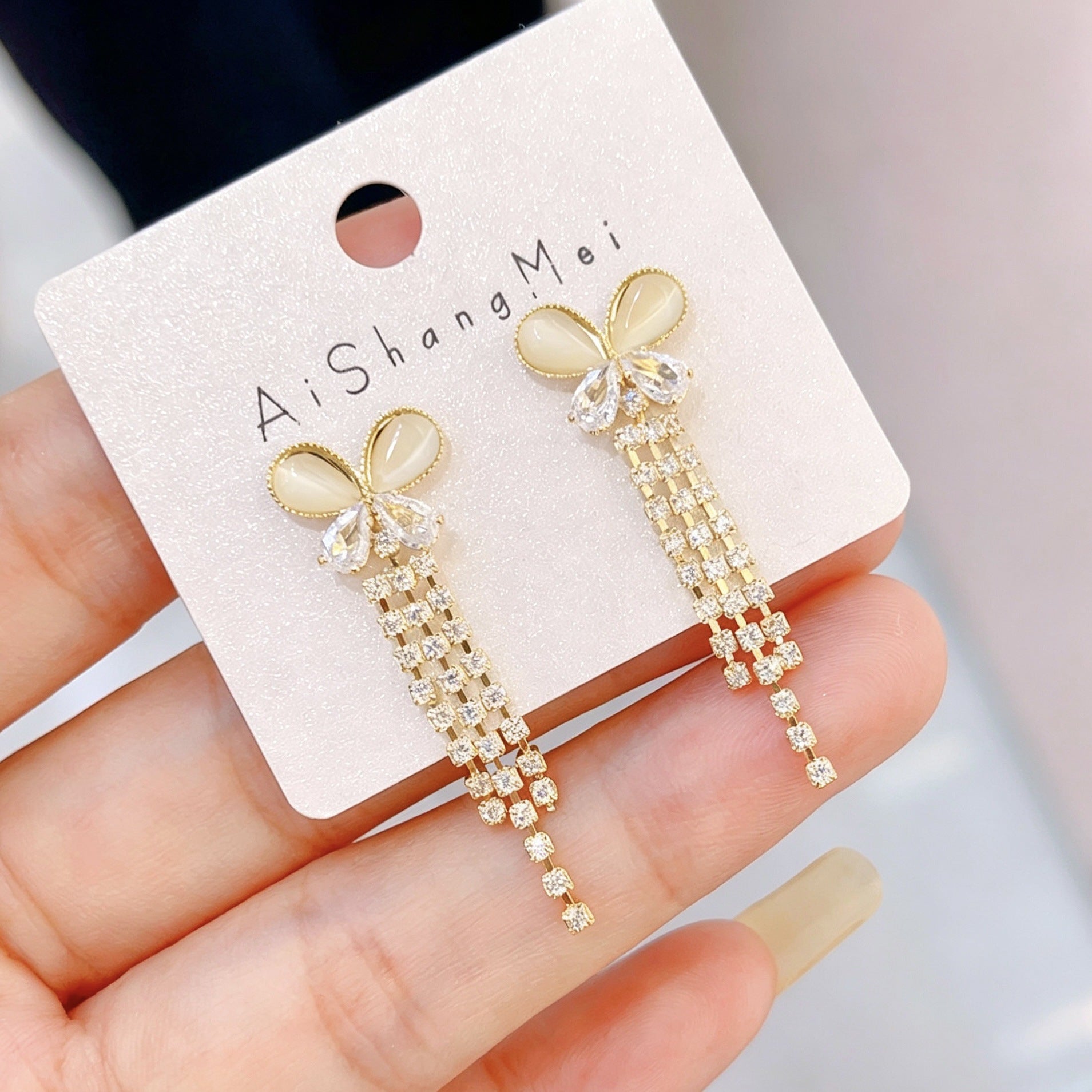 Bow Tie Tassel Earrings For Women In Copper With Real Gold Plated Finish And Zircon Inlay