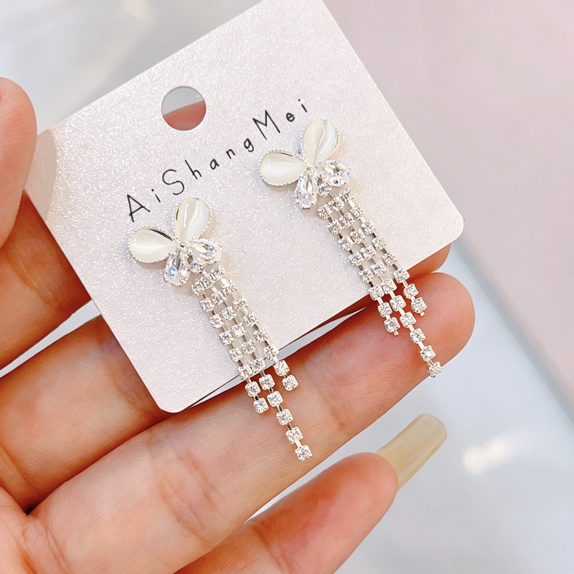 Bow Tie Tassel Earrings For Women In Copper With Real Gold Plated Finish And Zircon Inlay