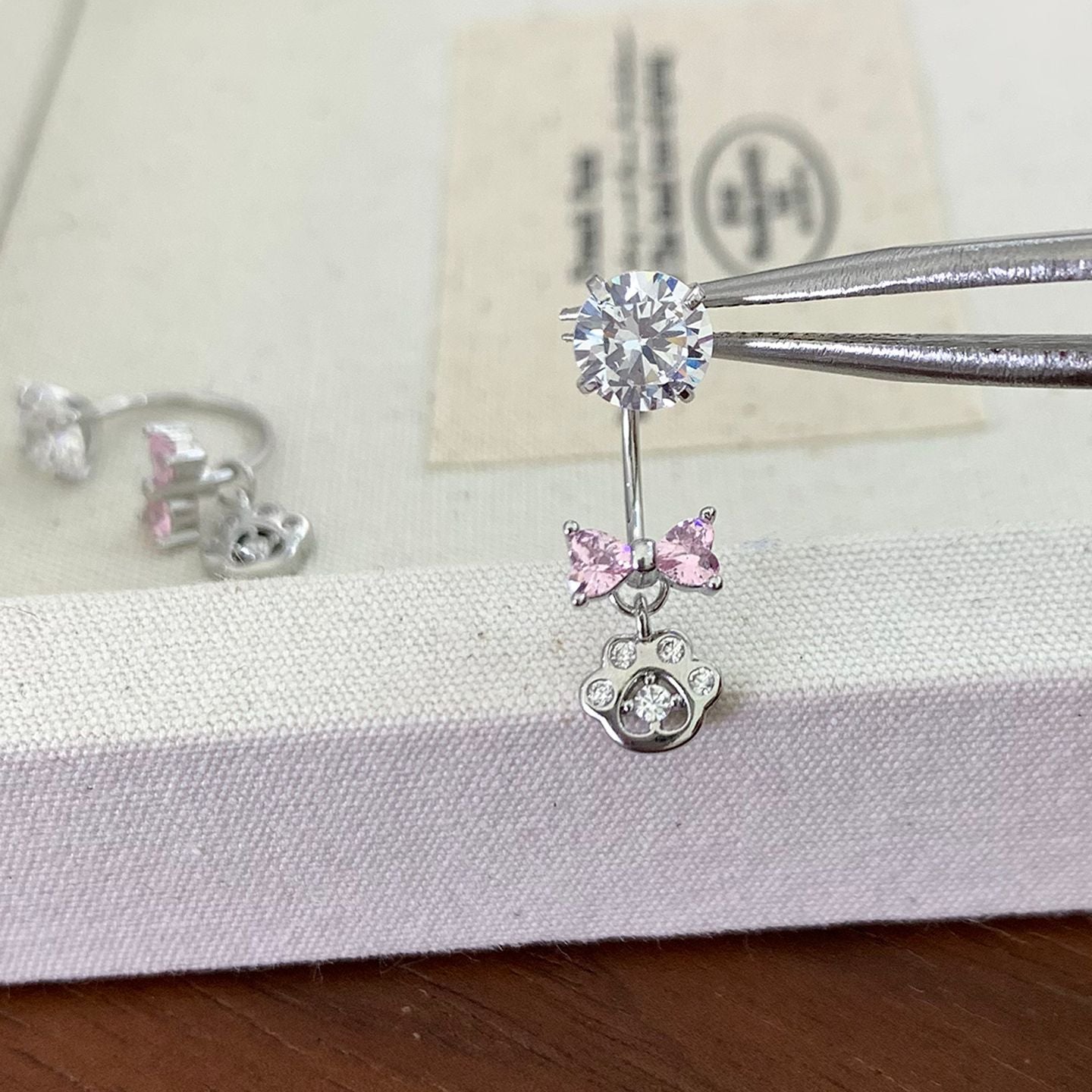 Bow Tie Earrings In Titanium Steel With Zircon Inlay, Featuring 316L Stainless Steel Posts, Unisex Design In Natural Pink